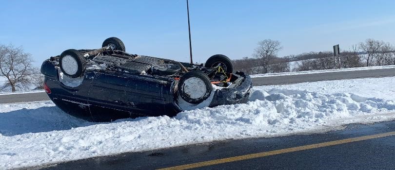 picture of car upside down in the snow