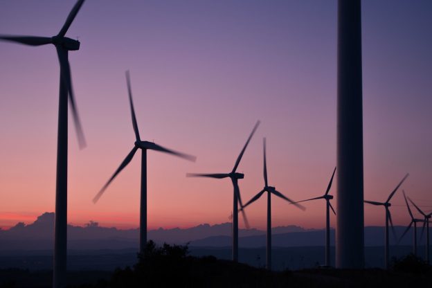 windmills against an evening sky