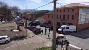 police surround a brick building